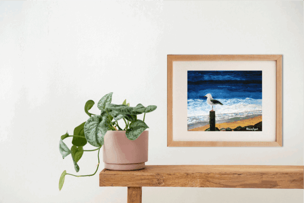 Original painting, "Silver Gull on a Fencepost" displayed on a wall